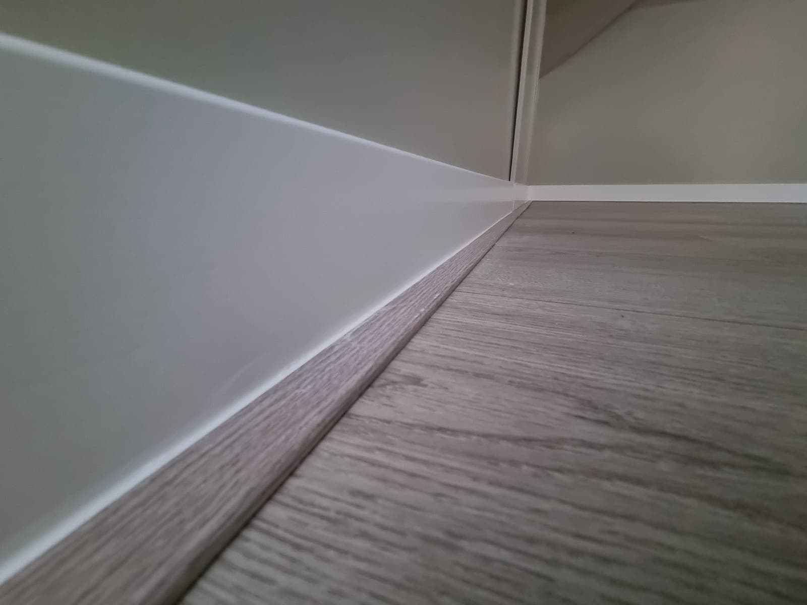 Crisp line between skirting and floor, close-up of our lacquer work